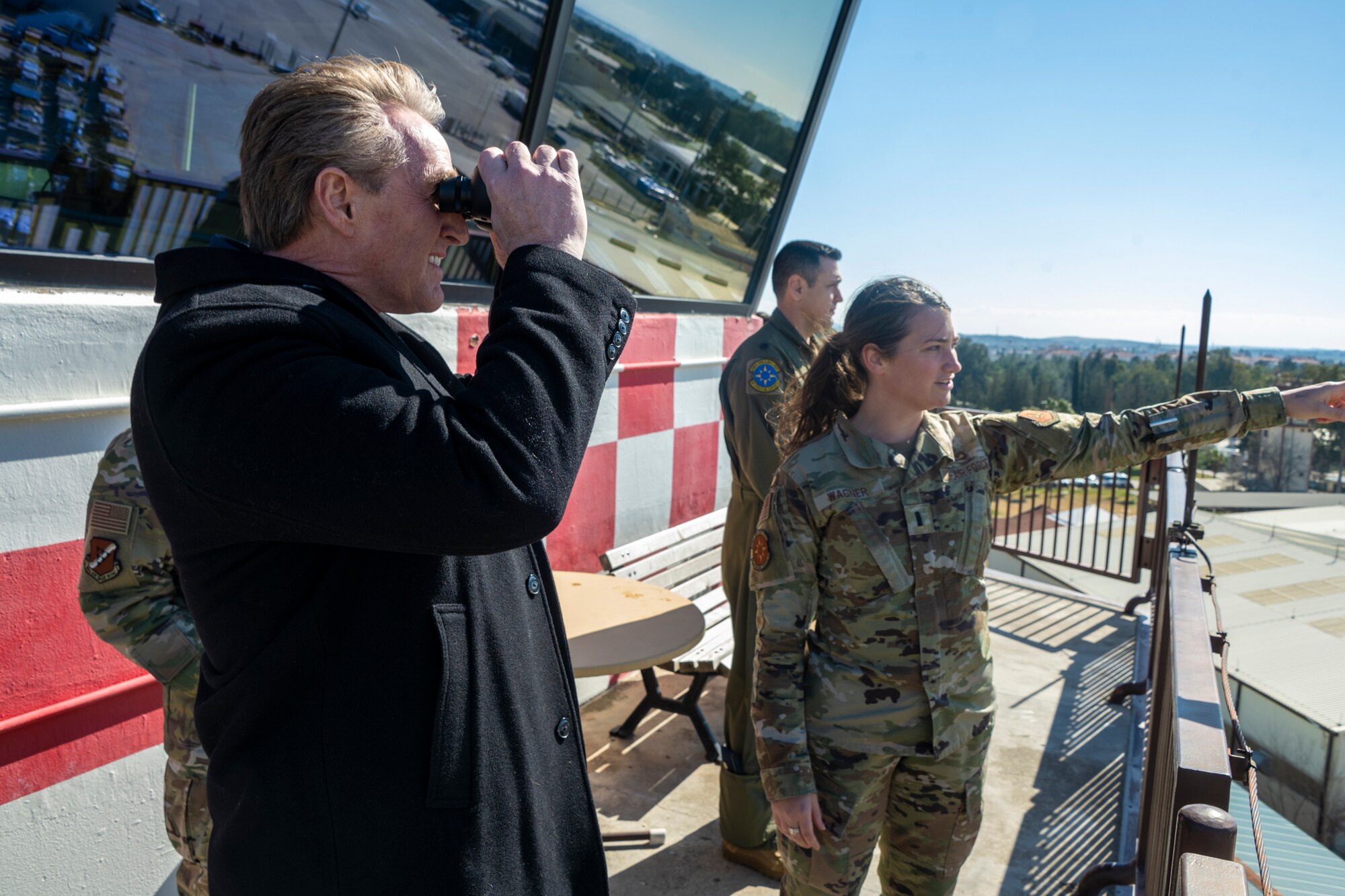 U.S. Ambassador Jeffry Flake, U.S. Ambassador to Türkiye, left, observes the airfield through binoculars while 1st Lt. Alisa Wagner, 39th Operations Support Squadron Airfield Operations Flight director of operations, points towards the flightline during his visit to Incirlik Air Base, Türkiye, Feb 13, 2023. Ambassador Flake visited Incirlik AB to discuss the recent earthquakes that struck central-southern Türkiye on Feb 6, 2023, and see the humanitarian support efforts first-hand. As Ambassador to Türkiye, Flake holds the highest civilian position as The Chief of Mission, and impacts the communication and resources of U.S. personnel, advancing the U.S. foreign policy goals. As a fellow NATO ally, the U.S. Government mobilized personnel to assist Türkiye in their response efforts. (U.S. Air Force photo by Senior Airman David D. McLoney)