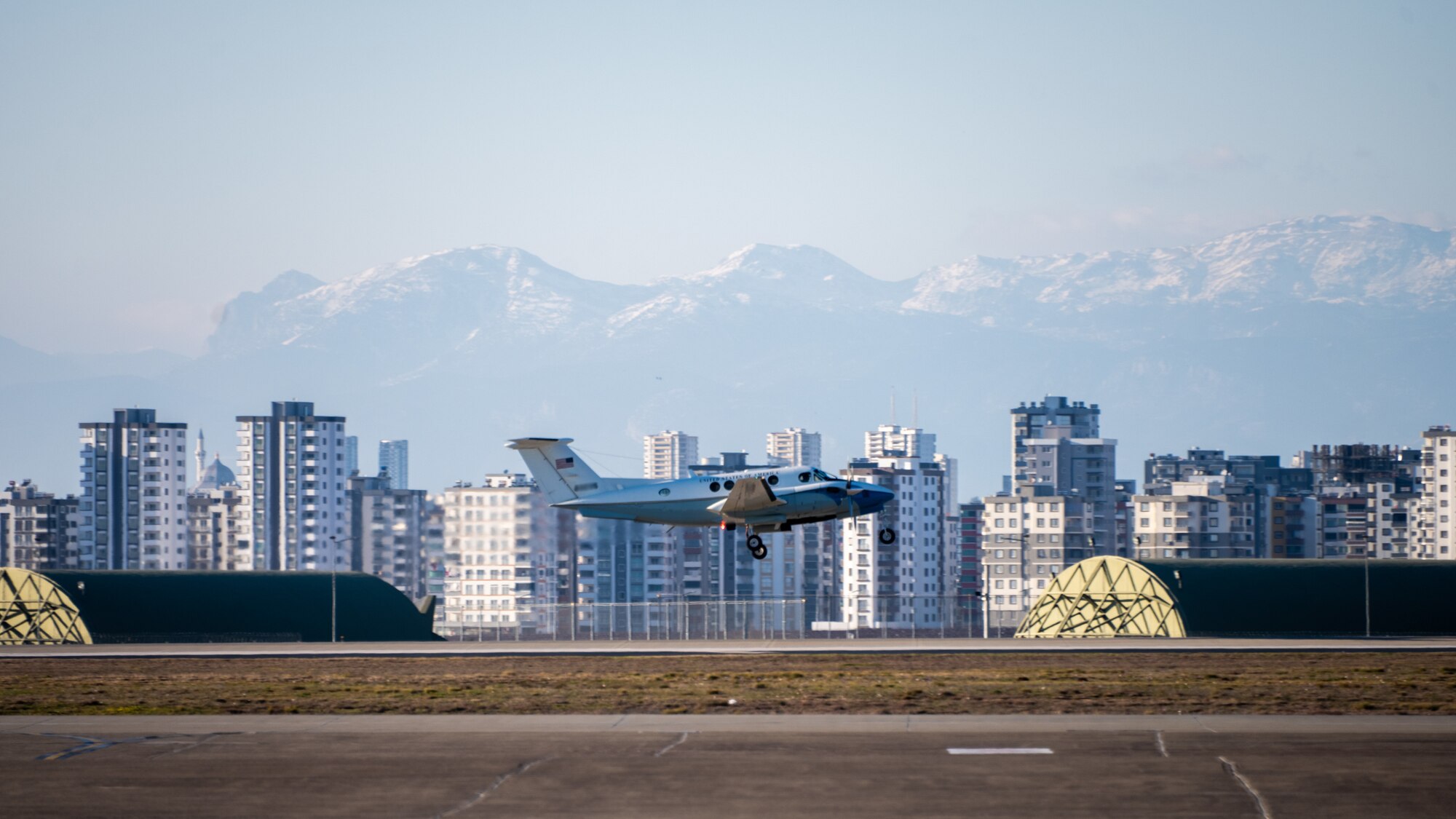 A plane carrying U.S. Ambassador Jeffry Flake, U.S. Ambassador to Türkiye, takes off from the runway at Incirlik Air Base, Türkiye, Feb 13, 2023. Ambassador Flake visited Incirlik AB to discuss the recent earthquakes that struck central-southern Türkiye on Feb 6, 2023, and see the humanitarian support efforts first-hand. As Ambassador to Türkiye, Flake holds the highest civilian position as The Chief of Mission, and impacts the communication and resources of U.S. personnel, advancing the U.S. foreign policy goals. As a fellow NATO ally, the U.S. Government mobilized personnel to assist Türkiye in their response efforts. (U.S. Air Force photo by Senior Airman David D. McLoney) (This photo has been altered for security purposes by blurring out aircraft tail numbers)