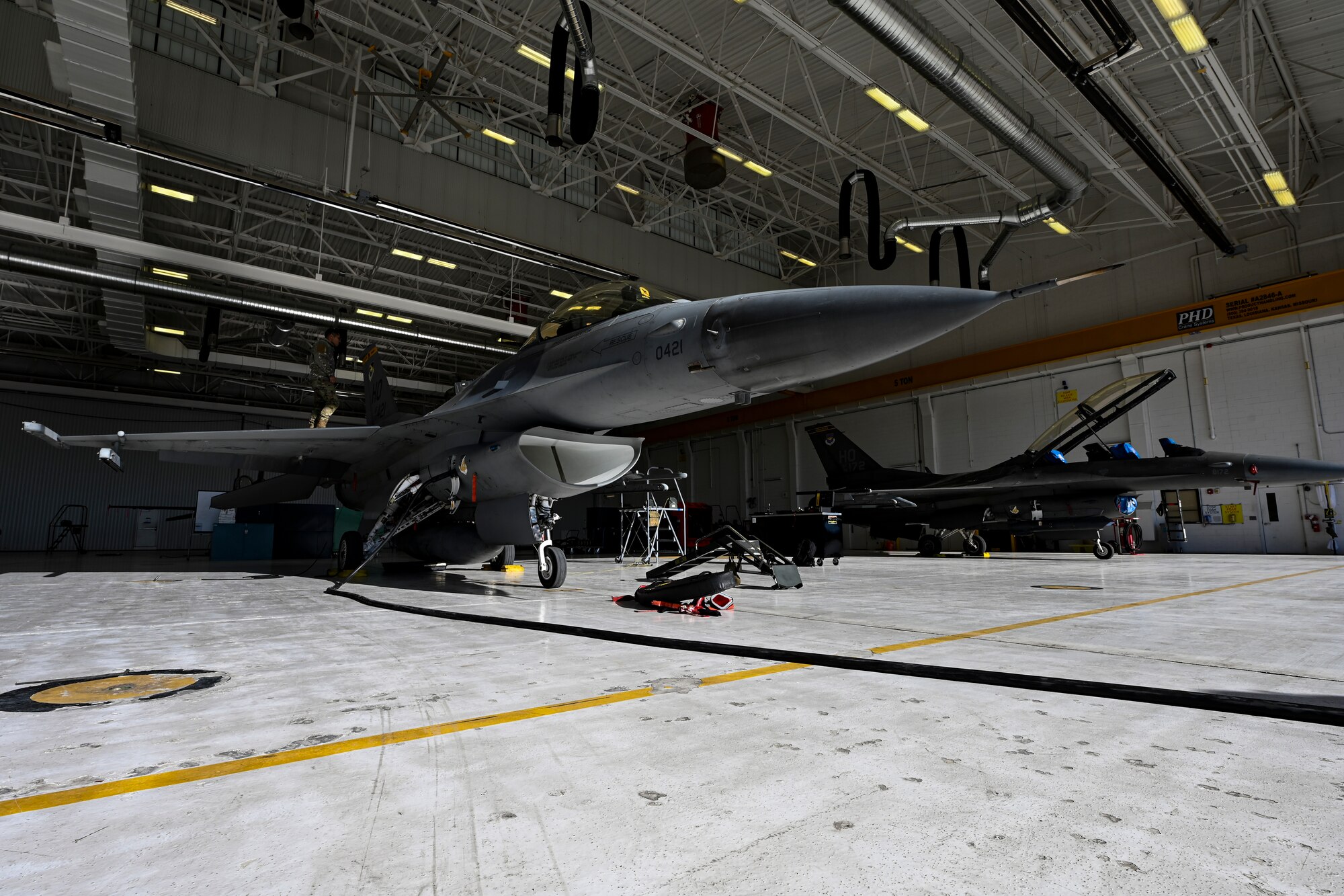 Two F-16 Vipers sit in the 49th Component Maintenance Squadron’s new hangar at Holloman Air Force Base, New Mexico, Feb. 8, 2023. The 49th CMS fuels shop's transition to their new hangar took approximately two years and has provided the shop with a larger work environment to maintain and refuel Holloman’s F-16 Vipers. (U.S. Air Force photo by Airman 1st Class Isaiah Pedrazzini)