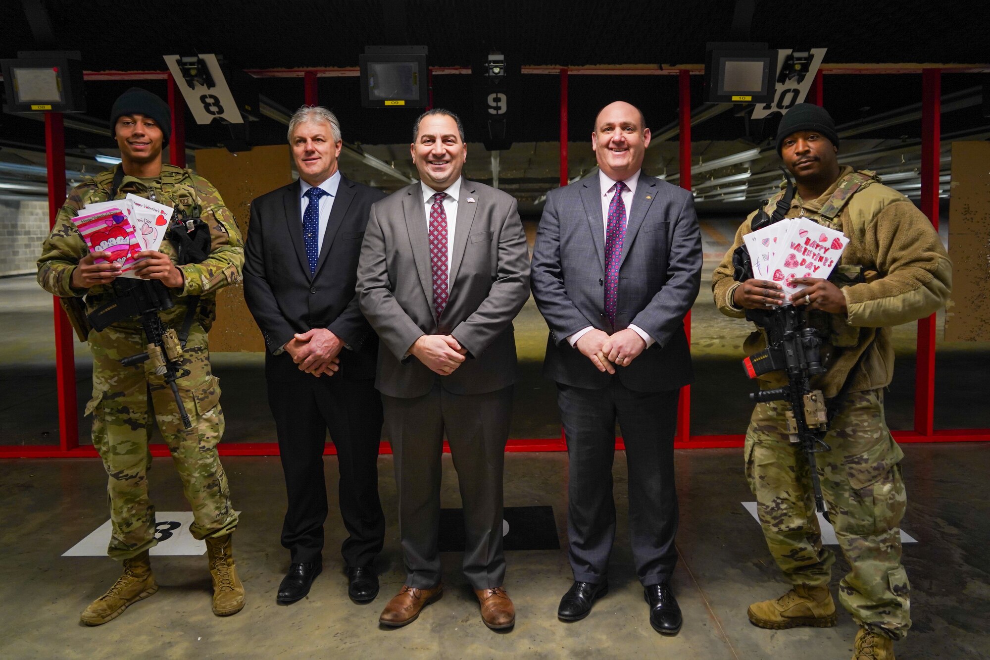 Erie County Legislators James Malczewski, Frank Todaro and Christopher Greene pose with airmen from the 914th Security Forces Squadron after touring the indoor firing range at Niagara Falls Air Reserve Station, N.Y.
