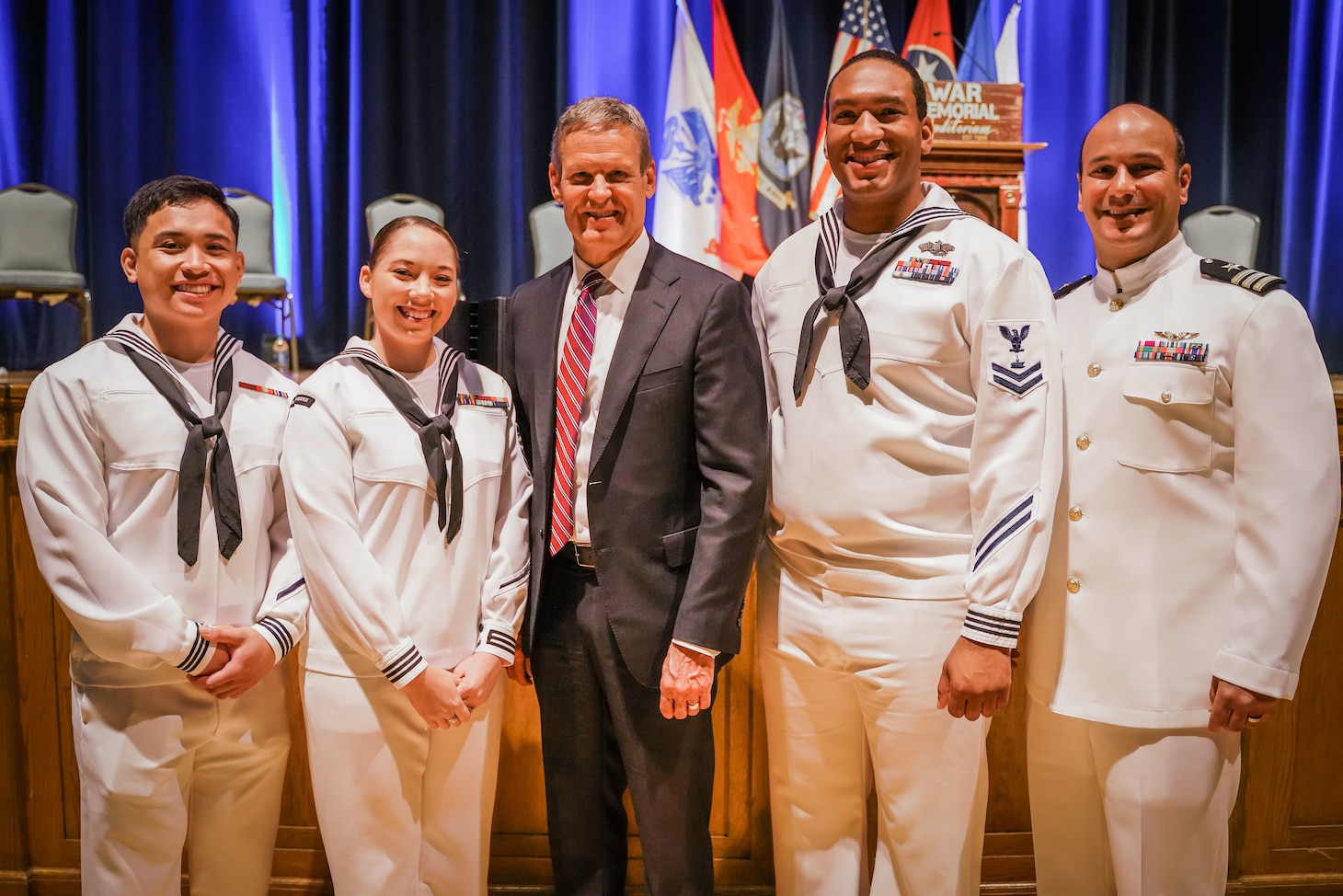 NRC Nashville color guard takes a photo with Governor Bill Lee after performing at a memorial day event.