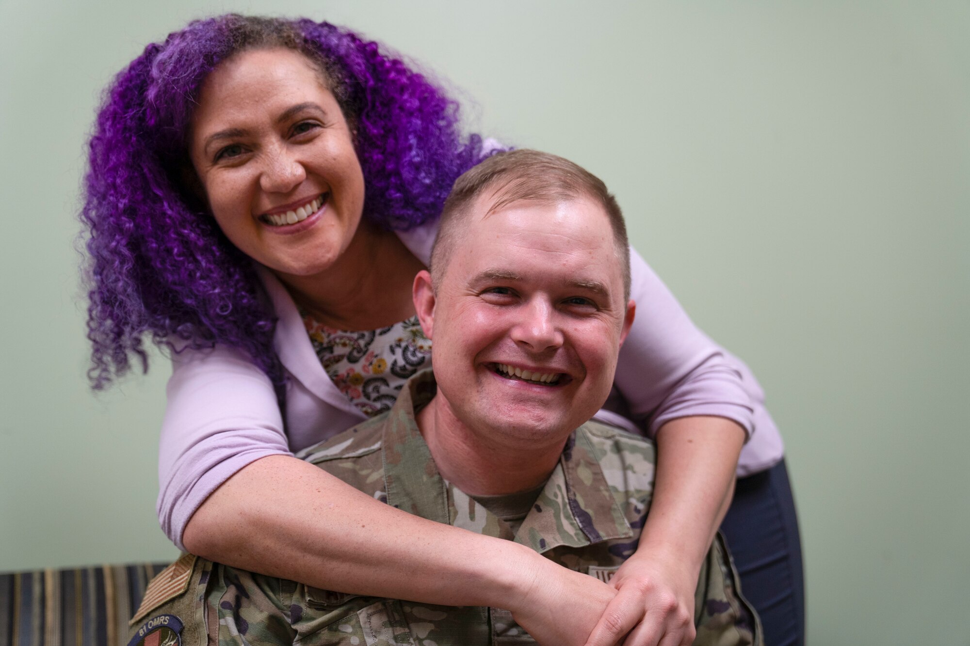 U.S Air Force Tech. Sgt. Alan Anderson, 81st Operational Readiness Medical Squadron mental health flight chief, and Leeann Bledsoe, 81st Operational Readiness Medical Squadron Alcohol and Drug Abuse Prevention and Treatment admin support, pose for photo on Keesler Air Force Base, Mississippi, Feb 10, 2023.
