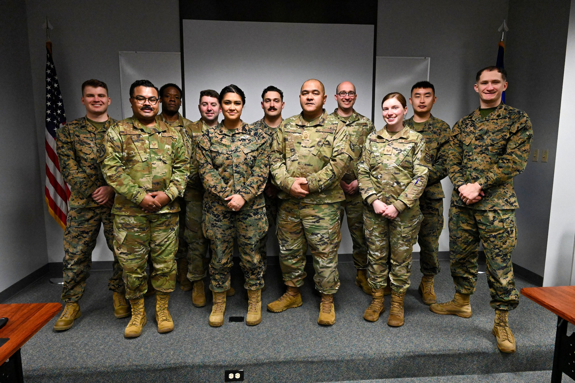 A group of service members pose for a group photo.