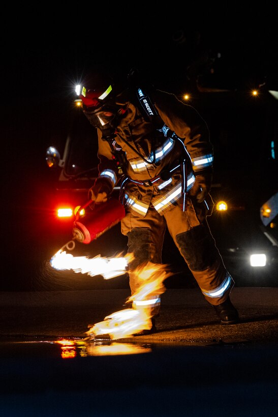 U.S. Marines with Aircraft Rescue and Firefighting practice responding to an aircraft fuel fire during an exercise on MCAS Miramar