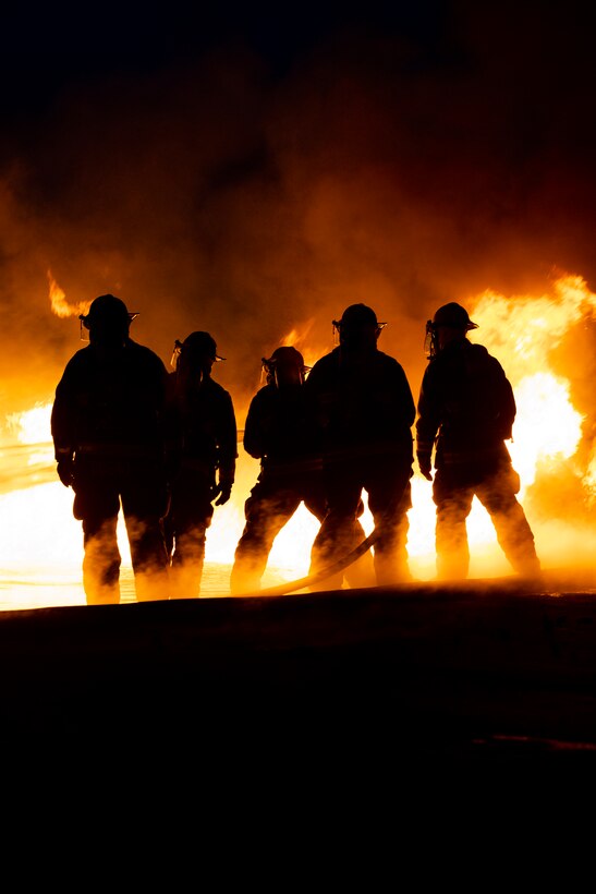 U.S. Marines with Aircraft Rescue and Firefighting practice responding to an aircraft fuel fire during an exercise on MCAS Miramar