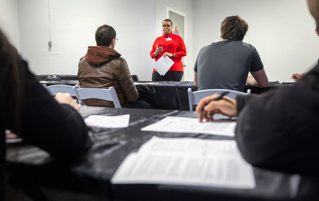 Chantel Chapman, Human Resources Specialist, Commander, U.S. Pacific Fleet Human Resources Office Northwest, leads federal résumé writing workshop Feb. 4, 2023, during the Puget Sound Naval Shipyard & Intermediate Maintenance Facility Hiring Fair at the Kitsap County Fairgrounds in Bremerton, Washington. (U.S Navy Photo by Wendy Hallmark)