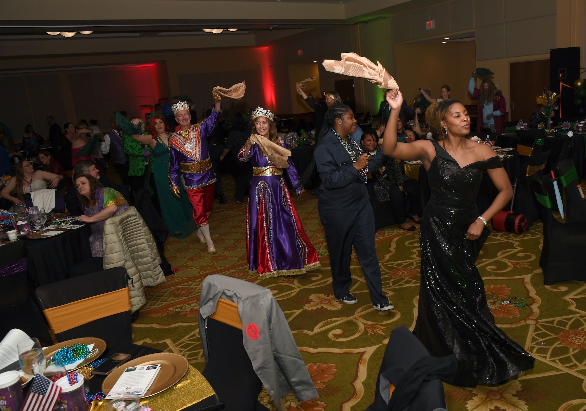 Members of the 81st Medical Group and guests participate in the second line parade during the 32nd Annual Krewe of Medics Mardi Gras Ball at the Bay Breeze Event Center on Keesler Air Force Base, Mississippi, Feb. 11, 2023.
