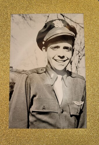 Black and white photo with man in Army uniform from World War II era