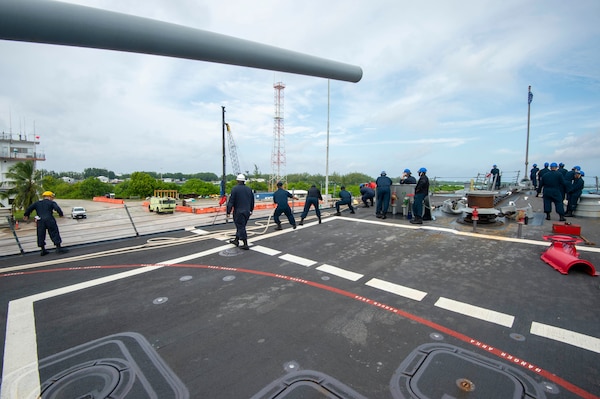 U.S. Navy Sailors handle line during sea-and-anchor detail on the foc'scle of the Arleigh Burke-class guided-missile destroyer USS Paul Hamilton (DDG 60) during a routine port visit. Paul Hamilton, part of the Nimitz Carrier Strike Group, is in U.S. 7th Fleet conducting routine operations. 7th Fleet is the U.S. Navy’s largest forward-deployed numbered fleet, and routinely interacts and operates with Allies and partners in preserving a free and open Indo-Pacific region. (U.S. Navy photo by Mass Communication Specialist 2nd Class Elliot Schaudt)