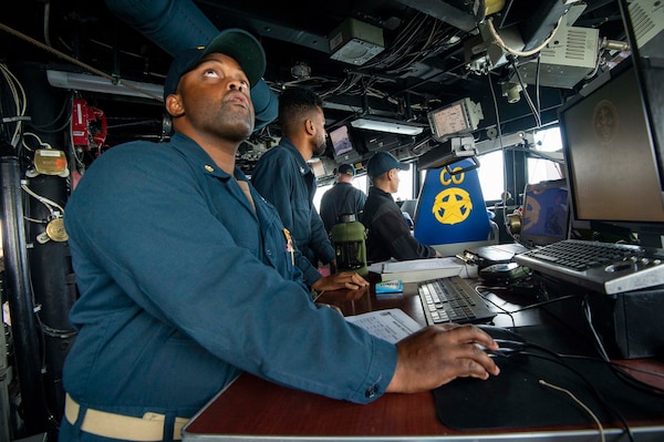 U.S. Navy Sailors man the quartermaster of the watch station on the bridge of the Arleigh Burke-class guided-missile destroyer USS Paul Hamilton (DDG 60) during a routine port visit. Paul Hamilton, part of the Nimitz Carrier Strike Group, is in U.S. 7th Fleet conducting routine operations. 7th Fleet is the U.S. Navy’s largest forward-deployed numbered fleet, and routinely interacts and operates with Allies and partners in preserving a free and open Indo-Pacific region. (U.S. Navy photo by Mass Communication Specialist 2nd Class Elliot Schaudt)