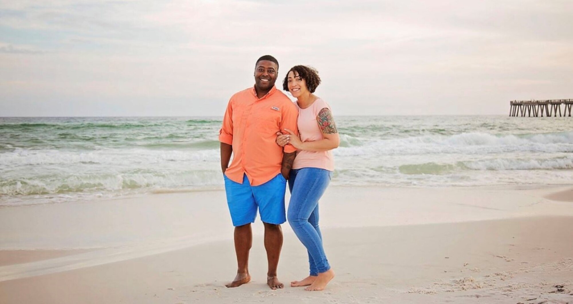 U.S. Air Force Master Sgt. Kelvin Lucky, 97th Security Forces Squadron operations superintendent, poses with his wife, Master Sgt. JaNiece Lucky, 97th Logistics Readiness Squadron first sergeant, on the beach, the day before Kelvin’s deployment in 2019. The secret to the Lucky's long lasting relationship is that they always have each other’s backs. (Courtesy photo by Master Sgt. JaNiece Lucky)
