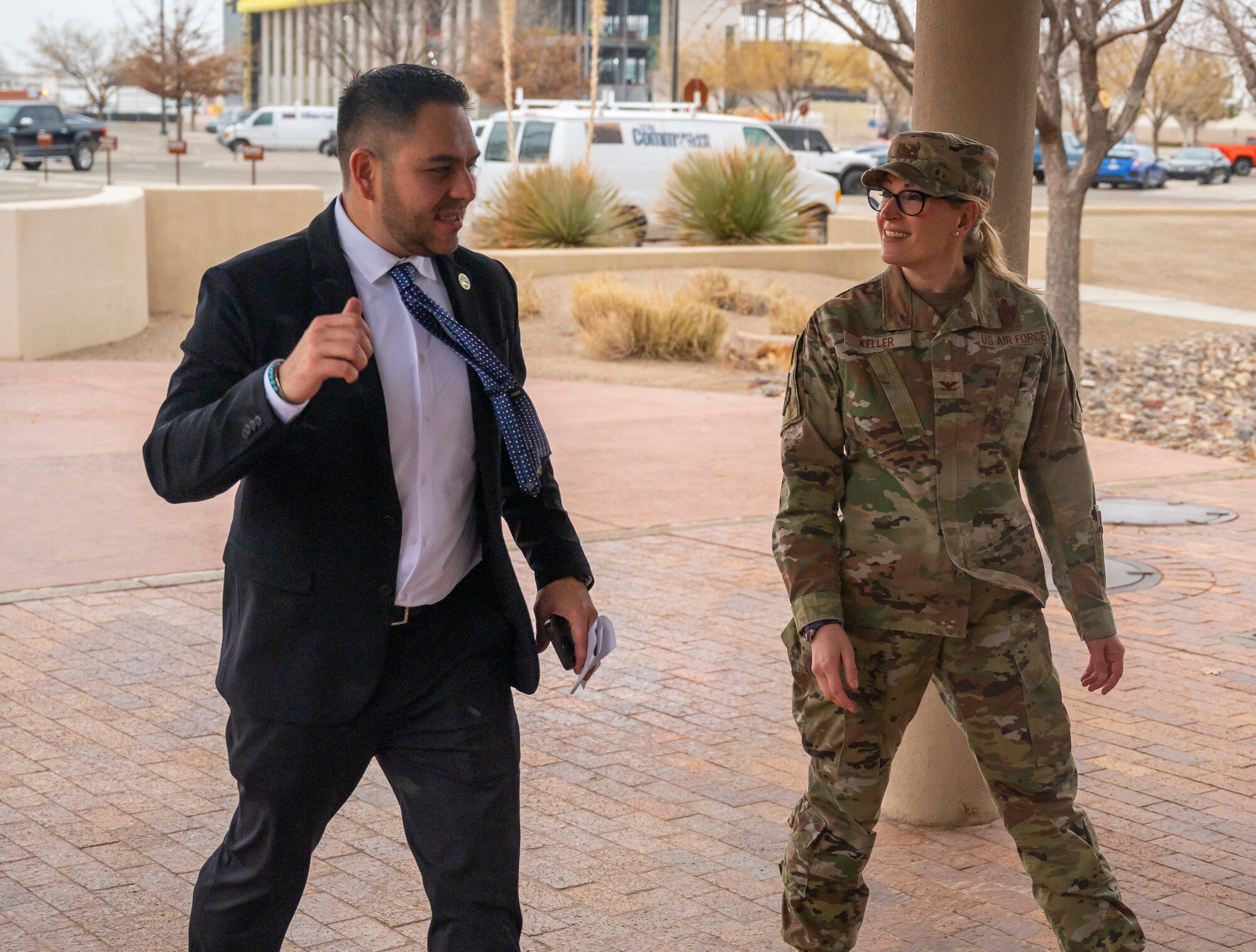 A man and woman walk together.