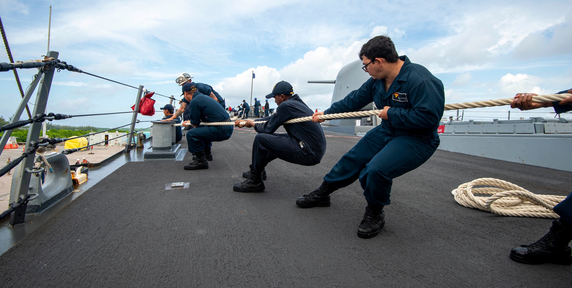 U.S. Navy Sailors heave line during sea-and-anchor detail on the foc'scle of the Arleigh Burke-class guided-missile destroyer USS Paul Hamilton (DDG 60) during a routine port visit. Paul Hamilton, part of the Nimitz Carrier Strike Group, is in U.S. 7th Fleet conducting routine operations. 7th Fleet is the U.S. Navy’s largest forward-deployed numbered fleet, and routinely interacts and operates with Allies and partners in preserving a free and open Indo-Pacific region. (U.S. Navy photo by Mass Communication Specialist 2nd Class Elliot Schaudt)