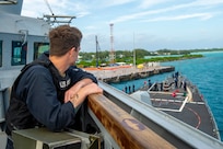 A U.S. Navy Sailor stands watch during sea-and-anchor detail on the bridgewing of the Arleigh Burke-class guided-missile destroyer USS Paul Hamilton (DDG 60) during a routine port visit. Paul Hamilton, part of the Nimitz Carrier Strike Group, is in U.S. 7th Fleet conducting routine operations. 7th Fleet is the U.S. Navy’s largest forward-deployed numbered fleet, and routinely interacts and operates with Allies and partners in preserving a free and open Indo-Pacific region. (U.S. Navy photo by Mass Communication Specialist 2nd Class Elliot Schaudt)