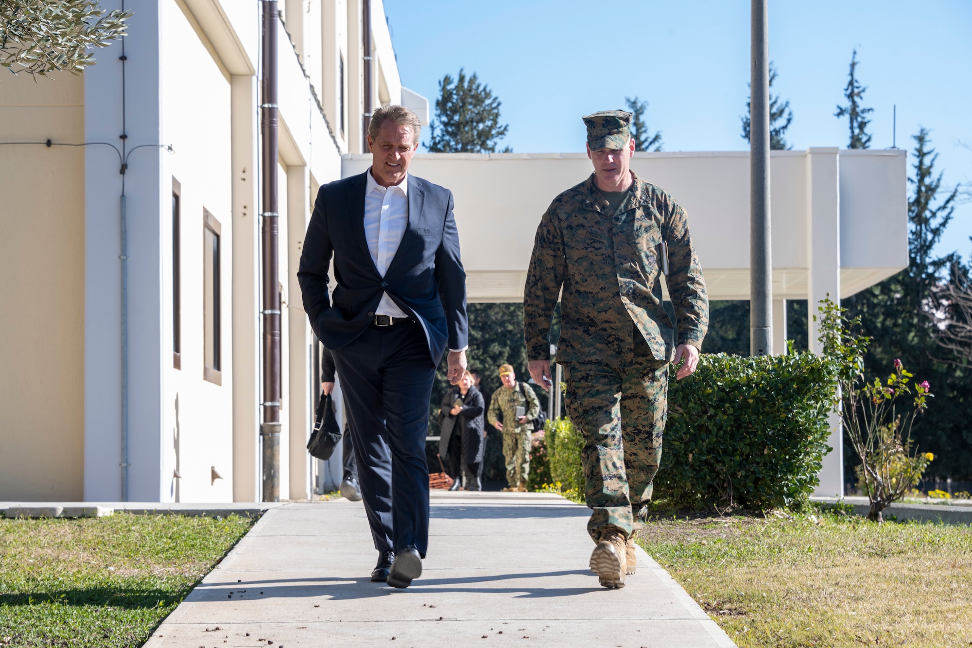 U.S. Ambassador Jeffry Flake, U.S. Ambassador to Türkiye, left, walks with U.S. Marine Corps Brig. Gen. Andrew Priddy, Task Force 61/2 commanding general, right, during his visit to Incirlik Air Base, Türkiye, Feb 13, 2023. Ambassador Flake visited Incirlik AB to discuss the recent earthquakes that struck central-southern Türkiye on Feb 6, 2023, and see the humanitarian support efforts first-hand. As Ambassador to Türkiye, Flake holds the highest civilian position as The Chief of Mission, and impacts the communication and resources of U.S. personnel, advancing the U.S. foreign policy goals. As a fellow NATO ally, the U.S. Government mobilized personnel to assist Türkiye in their response efforts. (U.S. Air Force photo by Senior Airman David D. McLoney)