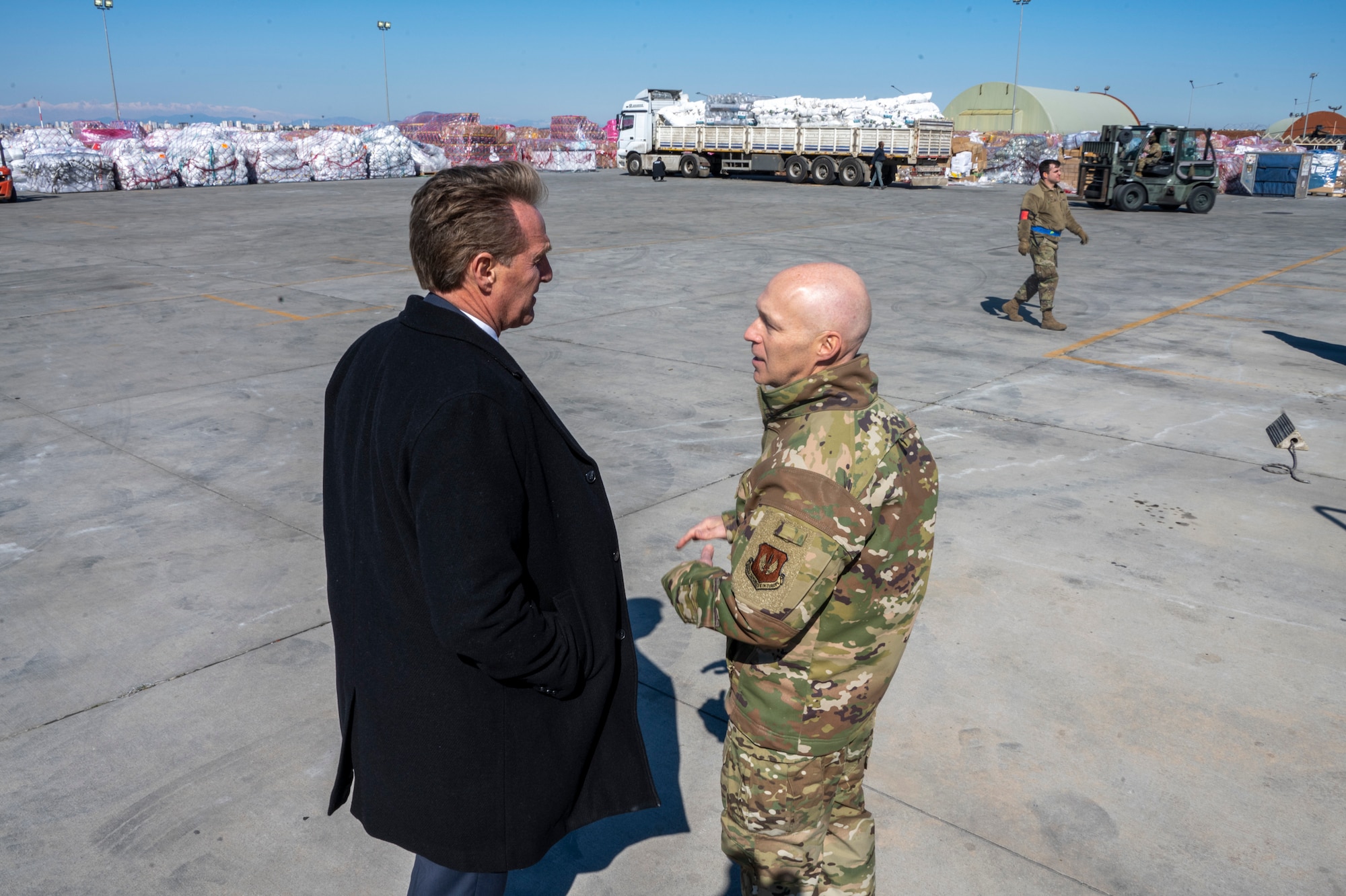 U.S. Ambassador Jeffry Flake, U.S. Ambassador to Türkiye, left, speaks with U.S. Air Force Col. Calvin B. Powell, 39th Air Base Wing commander, right, during his visit to Incirlik Air Base, Türkiye, Feb 13, 2023. Ambassador Flake visited Incirlik AB to discuss the recent earthquakes that struck central-southern Türkiye on Feb 6, 2023, and see the humanitarian support efforts first-hand. As Ambassador to Türkiye, Flake holds the highest civilian position as The Chief of Mission, and impacts the communication and resources of U.S. personnel, advancing the U.S. foreign policy goals. As a fellow NATO ally, the U.S. Government mobilized personnel to assist Türkiye in their response efforts. (U.S. Air Force photo by Senior Airman David D. McLoney)