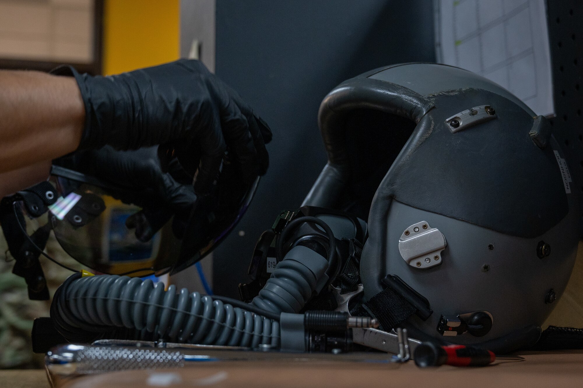 Alonzo Narvaez, a CTE Program Student, practices restoring flight equipment and inspects it before its subsequent use on Jan. 30, 2023, at Laughlin Air Force Base, Texas. Members of the local grow our own program get the opportunity to work in various workstations on base. (U.S. Air Force photo by Senior Airman David Phaff)