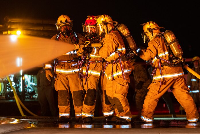 U.S. Marines with Aircraft Rescue and Firefighting practice responding to an aircraft fuel fire during an exercise on MCAS Miramar