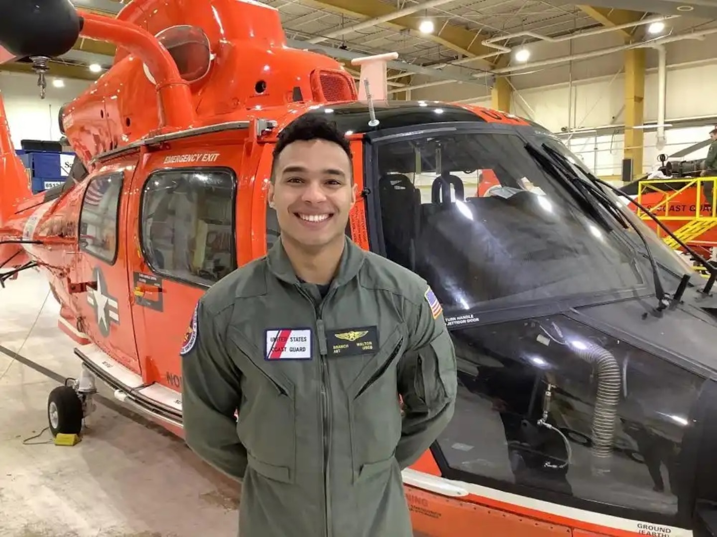 Petty Officer 3rd Class John "Branch" Walton, a rescue swimmer assigned to Air Station North Bend, Oregon, poses for a portrait at the air station Feb. 14, 2023. Walton rescued a mariner in distress Friday, Feb. 3, 2023, after the disabled, 35-foot vessel Sandpiper was capsized by a breaking wave approximately 6 miles west of the Columbia River mouth. (U.S. Coast Guard courtesy photo)