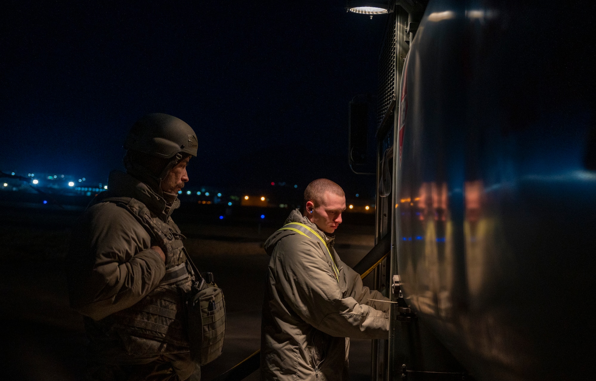 U.S. Air Force Staff Sgt. Zachary Smith, 51st Logistics Readiness Squadron (LRS) fuels distribution supervisor and Senior Airman Patrick Manley, 51st LRS fuels distribution operator check fuel pressure on an R-11 refueler truck during a training event at Daegu Air Base, Republic of Korea, Feb. 1, 2023.