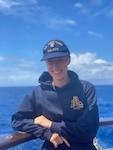 U.S. Coast Guard Academy Cadet 1st Class Hannah Bliss poses for a picture aboard the NRP Sagres while underway in the Atlantic Ocean, Aug. 17, 2022. The NRP Sagres is a sister ship to the Coast Guard Cutter Barque Eagle, and is still in use as a training vessel for the Portuguese Navy. (Coast Guard courtesy photo by First Cadet Hannah Bliss)