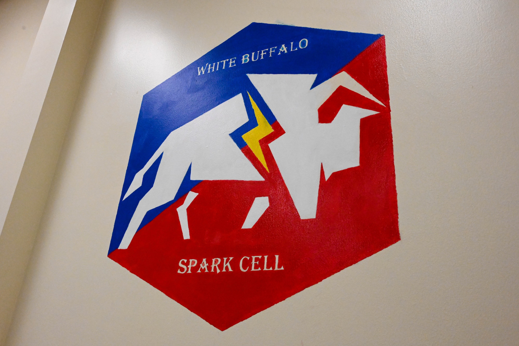 A mural by U.S. Air Force Airman Heather Price, 97th Training Squadron Airman in training, is displayed at the Spark Cell at Altus Air Force Base, Oklahoma, Feb. 13, 2023. The Air Force Innovation Handbook says, “great ideas can come from anybody, anywhere, from any rank.” (U.S. Air Force photo by Senior Airman Trenton Jancze)