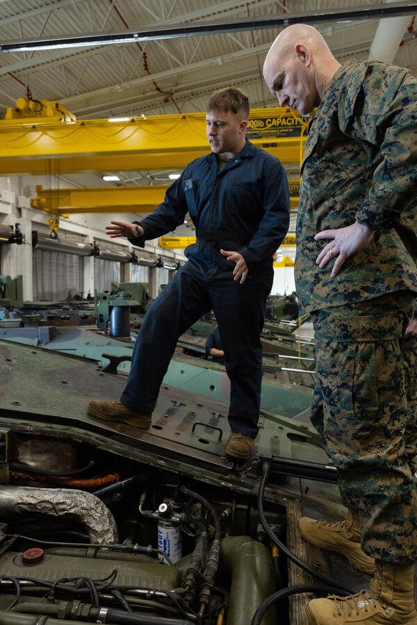 U.S. Marine Corps Sgt. Maj. Troy E. Black, the 19th Sergeant Major of the Marine Corps, learns about the mechanics of an amphibious combat vehicle from a Marine assigned to 3rd Assault Amphibian Battalion, 1st Marine Division during his visit to Marine Corps Base Camp Pendleton, California, Feb. 7, 2023. The Sergeant Major of the Marine Corps visited units across I Marine Expeditionary Force, speaking to Marines about talent management, force design, quality of life and the importance of maturing the force in the infantry. (U.S. Marine Corps photo by Lance Cpl. Fred Garcia)