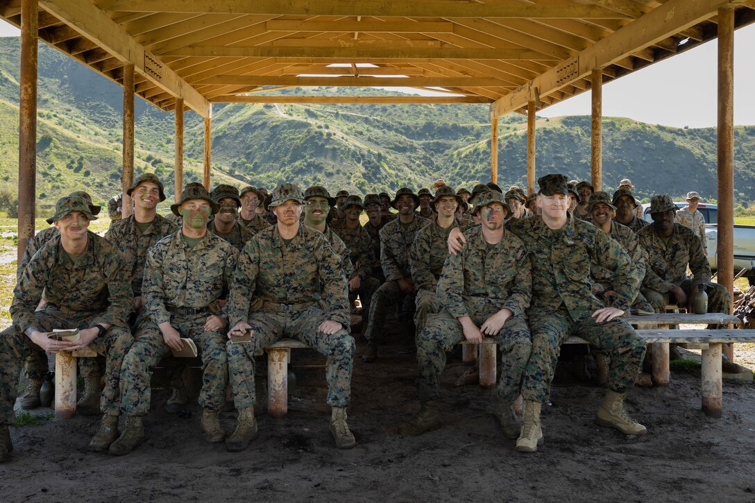U.S. Marine Corps Sgt. Maj. Troy E. Black, the 19th Sergeant Major of the Marine Corps, poses for a photo with Marines from 2nd Battalion, 5th Marine Regiment, 1st Marine Division conducting advanced infantry training during his visit to Marine Corps Base Camp Pendleton, California, Feb. 7, 2023. The Sergeant Major of the Marine Corps visited units across I Marine Expeditionary Force, speaking to Marines about talent management, force design, quality of life and the importance of maturing the force in the infantry. (U.S. Marine Corps photo by Lance Cpl. Fred Garcia)