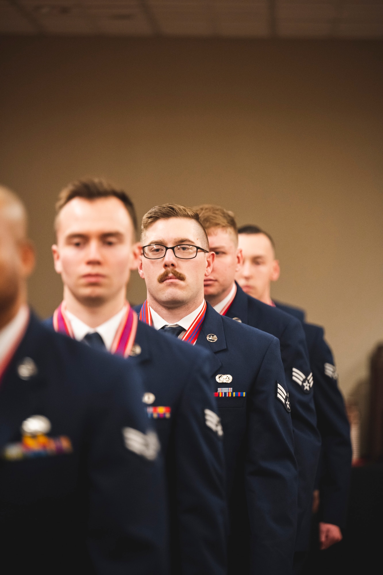 The Airman Leadership School class 23-B march into their graduation ceremony Feb. 9 at the Wright-Patt Club at Wright-Patterson Air Force Base, Ohio.