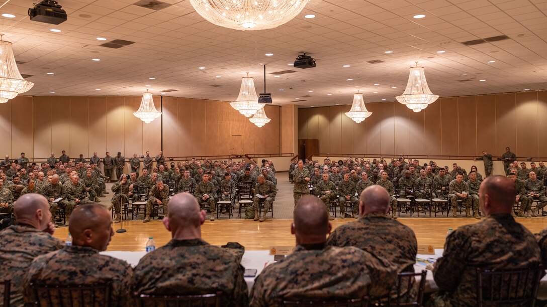 U.S. Marine Corps Master Gunnery Sgt. Chelsea E. Jones, logistics chief with 1st Marine Logistics Group, asks a question to Sgt. Maj. Troy E. Black, the 19th Sergeant Major of the Marine Corps, and fellow sergeants major during a staff noncommissioned officer senior leader panel at Marine Corps Base Camp Pendleton, California, Feb. 8, 2023. The Sergeant Major of the Marine Corps visited units across I Marine Expeditionary Force, speaking to Marines about talent management, force design, quality of life and the importance of maturing the force in the infantry. (U.S. Marine Corps photo by Cpl. Gabrielle Zagorski)