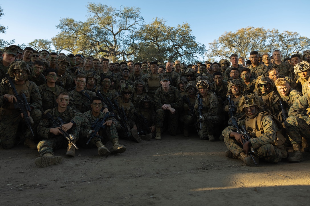 U.S. Marine Corps Sgt. Maj. Troy E. Black, the 19th Sergeant Major of the Marine Corps, poses for a photo with a group of Marines undergoing the Infantry Marine Course at Infantry Training Battalion, School of Infantry – West during his visit to Marine Corps Base Camp Pendleton, California, Feb. 7, 2023. The Sergeant Major of the Marine Corps visited units across I Marine Expeditionary Force, speaking to Marines about talent management, force design, quality of life and the importance of maturing the force in the infantry. (U.S. Marine Corps photo by Lance Cpl. Fred Garcia)