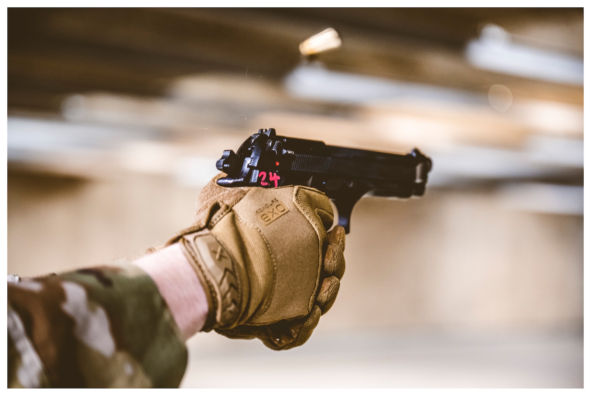 An Airman fires an M9 during German Armed Forces Proficiency Badge testing Feb. 2 at the 88th Security Forces Squadron’s firing range on Wright-Patterson Air Force Base, Ohio.