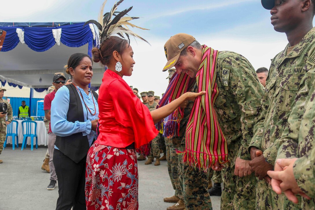Sailors are greeted by Timor-Leste residents upon arrival.