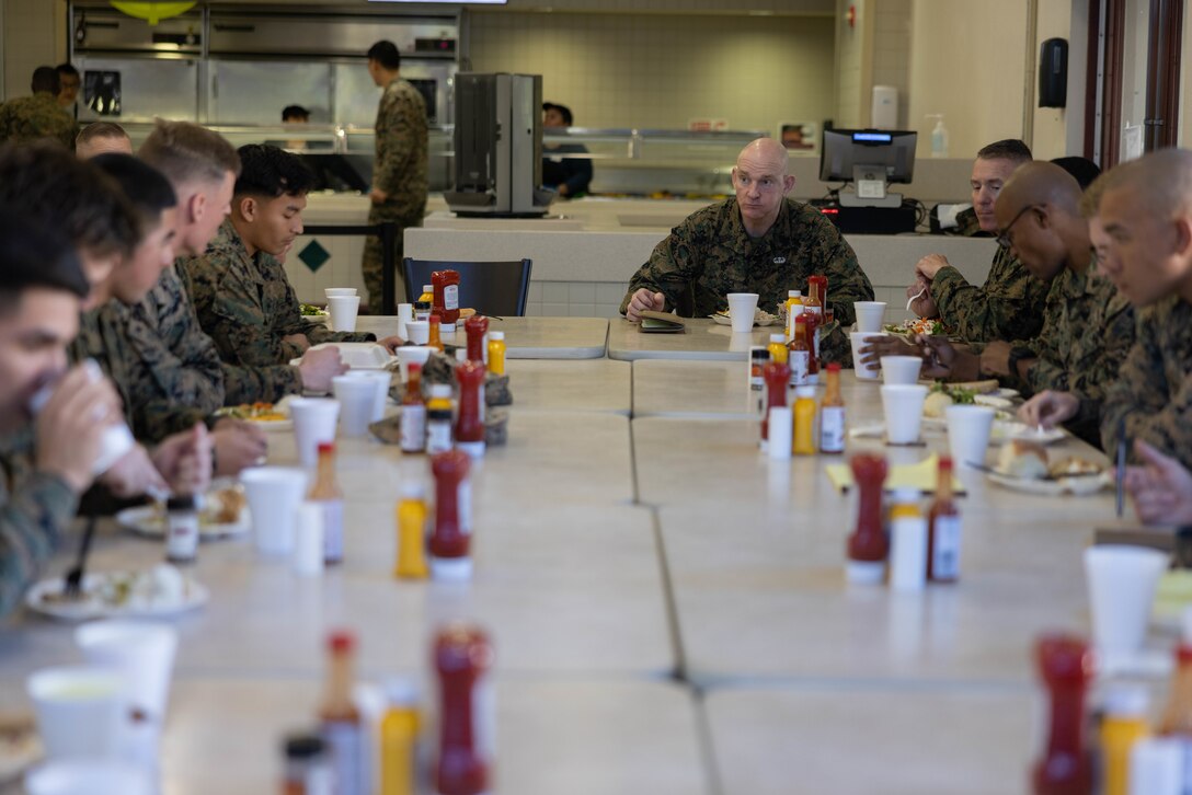 U.S. Marine Sgt. Maj. Troy E. Black, the sergeant major of the Marine Corps, answers questions from noncommissioned officers from 5th Marine Regiment, 1st Marine Division, while eating lunch on Marine Corps Base Camp Pendleton, California, Feb. 7, 2023. Black’s visit with Camp Pendleton units allows him to advocate for quality of life for the Marines at operational units whose focus is warfighting and training for warfighting. He also spoke with noncommissioned officers regarding the changes associated with Force Design 2030, and the training and education that will prepare them to lead Marines in a fight in the future. (U.S. Marine Corps photo by Lance Cpl. Juan Torres)