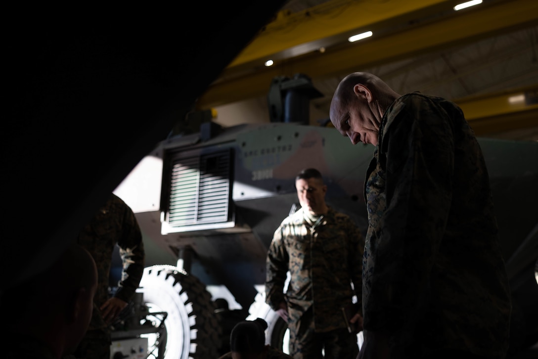 U.S. Marine Sgt. Maj. Troy E. Black, the sergeant major of the Marine Corps, talks with Marines from 3rd Assault Amphibian Battalion, 1st Marine Division, about the Amphibious Combat Vehicle during a visit to Marine Corps Base Camp Pendleton, California, Feb. 7, 2023. Black’s visit with Camp Pendleton units allows him to advocate for quality of life for the Marines at operational units whose focus is warfighting and training for warfighting. He also spoke with noncommissioned officers regarding the changes associated with Force Design 2030, and the training and education that will prepare them to lead Marines in a fight in the future. (U.S. Marine Corps photo by Lance Cpl. Juan Torres)