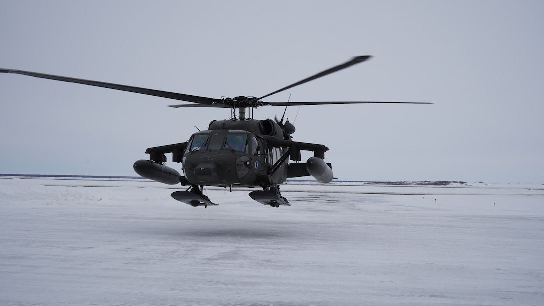 An Alaska Army National Guard UH-60L Black Hawk helicopter hovers near the aviation facility at the Bethel Airport after returning from a training flight.  The helicopter is stationed in Bethel for the time being to allow aircrews to train for federal mission requirements and become more familiar with the area.  The aircraft will be available to assist in emergency situations as requested by the Alaska Rescue Coordination Center or Alaska Emergency Operations Center and subject to aircrew availability.  (Alaska National Guard Photo by Dana Rosso)