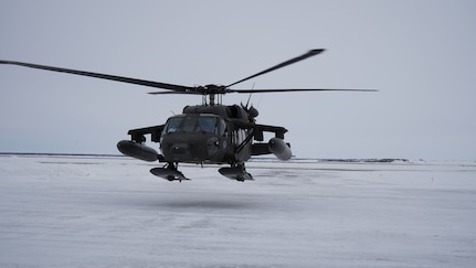 An Alaska Army National Guard UH-60L Black Hawk helicopter hovers near the aviation facility at the Bethel Airport after returning from a training flight.  The helicopter is stationed in Bethel for the time being to allow aircrews to train for federal mission requirements and become more familiar with the area.  The aircraft will be available to assist in emergency situations as requested by the Alaska Rescue Coordination Center or Alaska Emergency Operations Center and subject to aircrew availability.  (Alaska National Guard Photo by Dana Rosso)