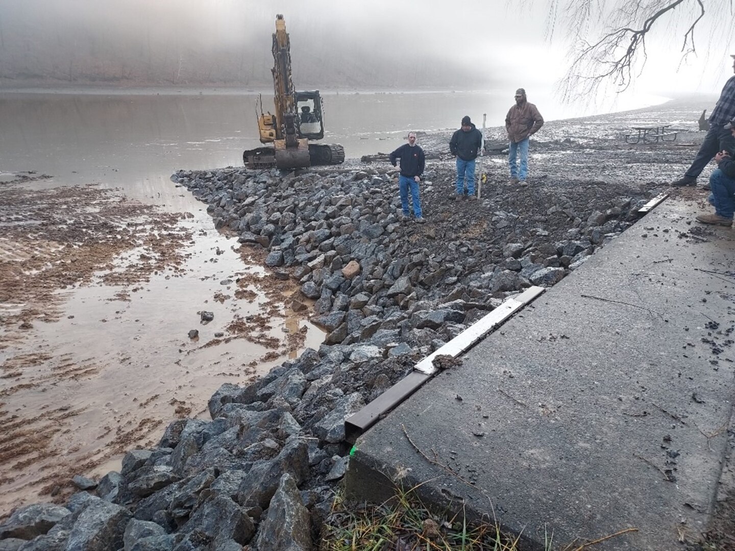Crew removes sediment beneath dock.