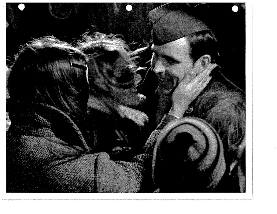 Air Force Master Sgt. William A. Robinson receives a pat on the cheek as he stepped of a C-141 arriving at Scott Air Force Base, Feb. 14, 1973. Robinson, of Robersonville, North Carolina, was among the first 11 ex-prisoners returned to the U.S.