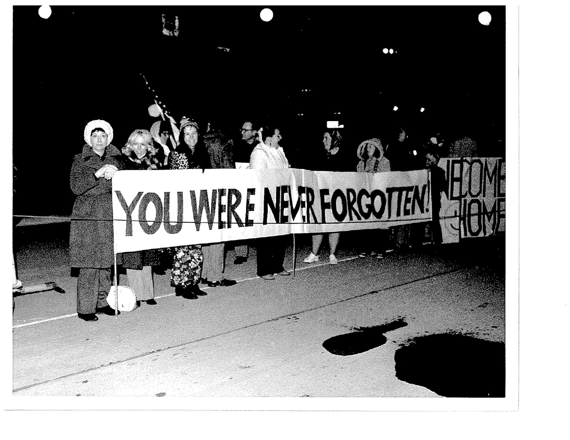 Banners, flags, and signs carried by persons greeting the returnees were evidence of the emotions involved in Operation Homecoming. “You Were Never Forgotten” was one message conveyed to ex-POWs arriving at Scott Air Force Base.