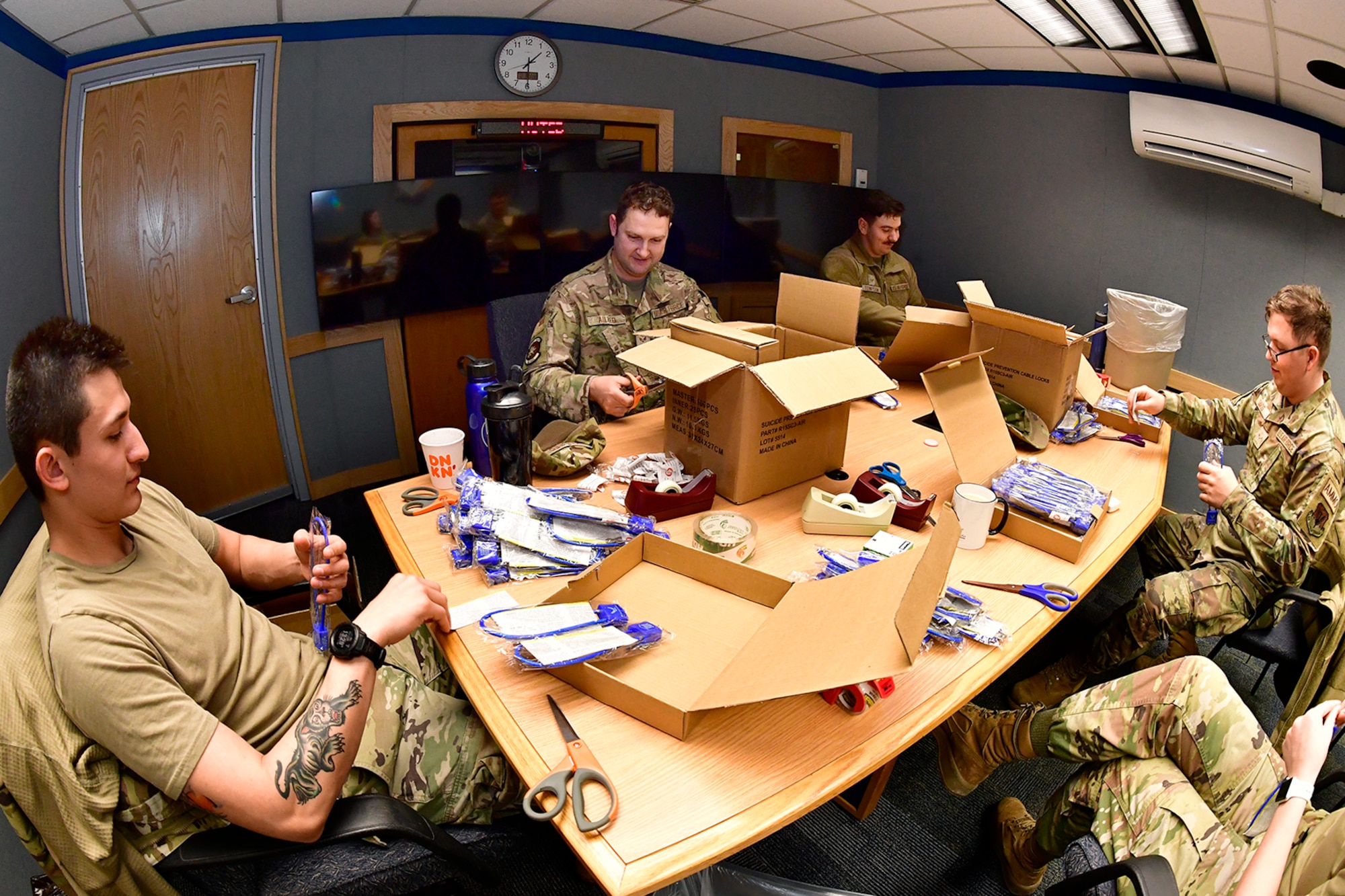 Volunteer Airmen from the 388th Fighter Wing prepare suicide prevention cable locks for distribution Feb. 7, 2023, at Hill Air Force Base, Utah. These locks were provided by the Headquarters Air Force Suicide Prevention Program and are known as a time-based prevention tool, designed to delay access to firearms and medicine, for those contemplating suicide during an emotionally charged moment. (U.S. Air Force photo by Todd Cromar)