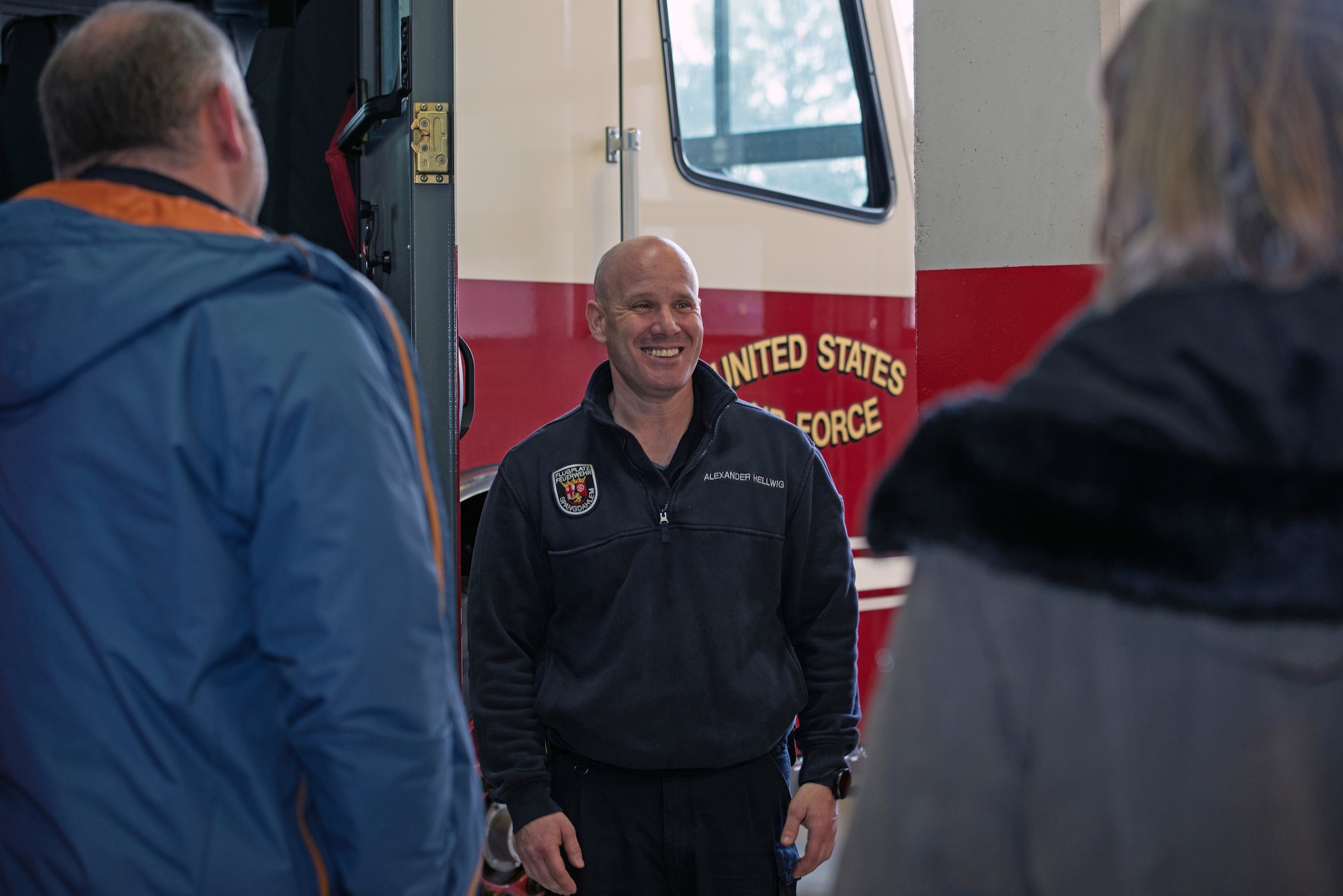 A firefighter talks to civilian employees