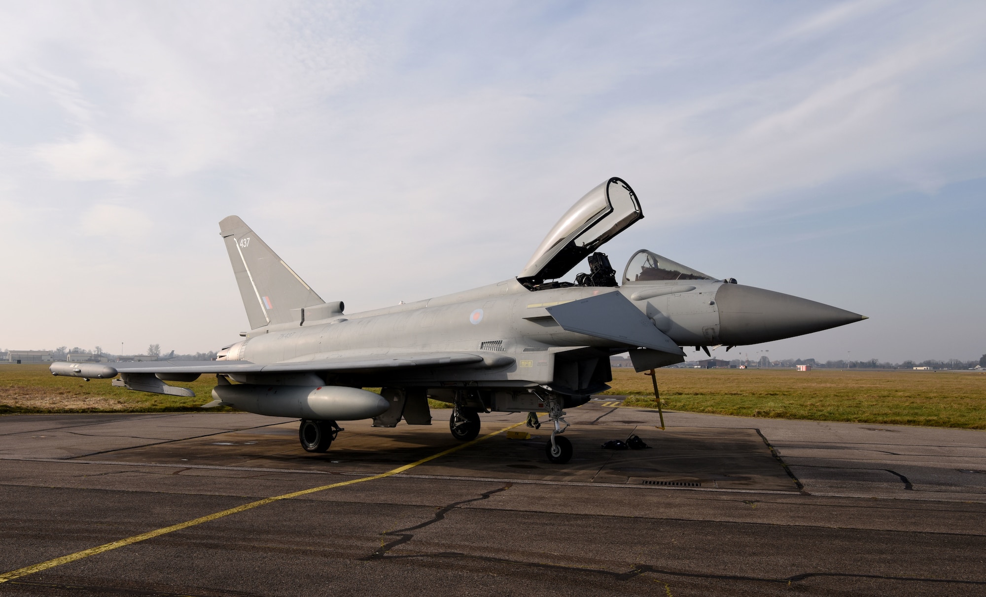 A Royal Air Force Eurofighter Typhoon FGR4 sits on the taxiway at Royal Air Force Mildenhall, England, Feb. 15, 2023. The aircraft, from RAF Coningsby, England, diverted here due to bad weather. The Typhoon is a highly capable and extremely agile multi-role combat aircraft, capable of being deployed for the full spectrum of air operations, including air policing, peace support and high-intensity conflict. (U.S. Air Force photo by Karen Abeyasekere)