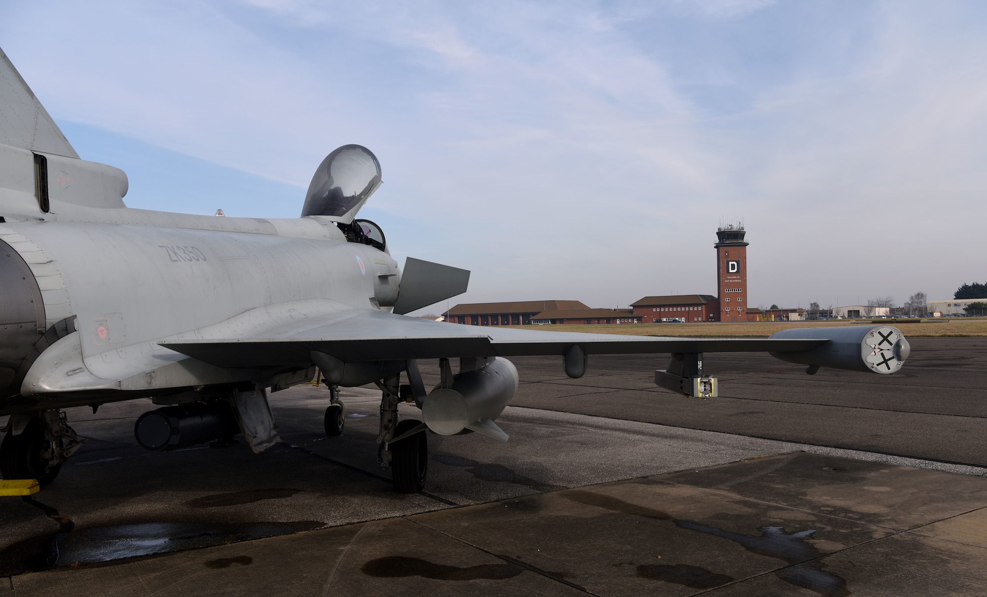 A Royal Air Force Eurofighter Typhoon sits on the taxiway at Royal Air Force Mildenhall, England, Feb. 15, 2023. The aircraft, from RAF Coningsby, England, diverted here due to bad weather. The Typhoon is a highly capable and extremely agile multi-role combat aircraft, and the pilot performs many essential functions through the aircraft’s hands on throttle and stick interface which, combined with an advanced cockpit and the helmet equipment assembly, renders the Typhoon superbly equipped for all aspects of air operations. (U.S. Air Force photo by Karen Abeyasekere)
