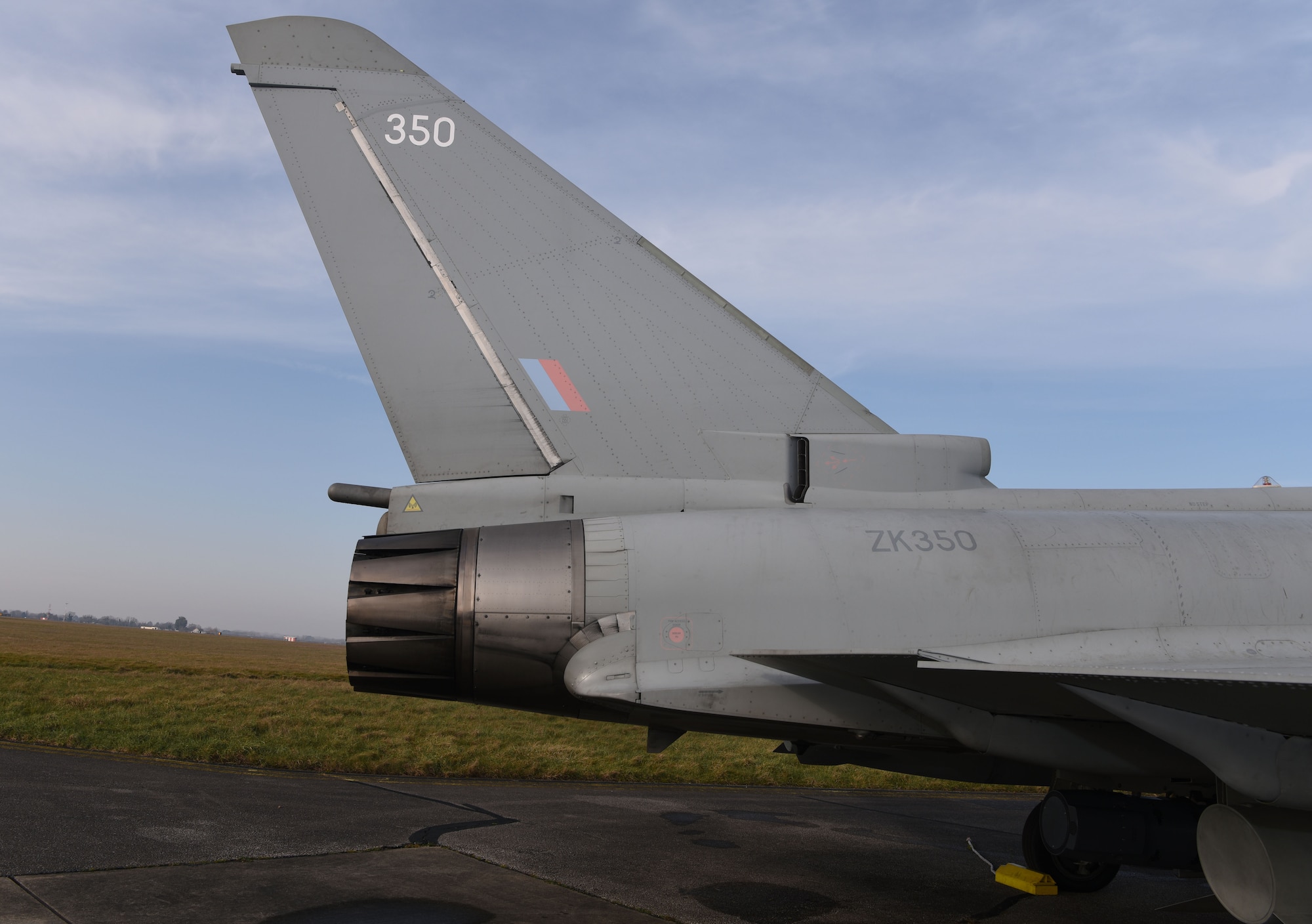 A Royal Air Force Eurofighter Typhoon FGR4 sits on the taxiway at Royal Air Force Mildenhall, England, Feb. 15, 2023. The aircraft, from RAF Coningsby, England, diverted here due to bad weather. The Typhoon is a highly capable and extremely agile multi-role combat aircraft, capable of being deployed for the full spectrum of air operations, including air policing, peace support and high-intensity conflict. (U.S. Air Force photo by Karen Abeyasekere)