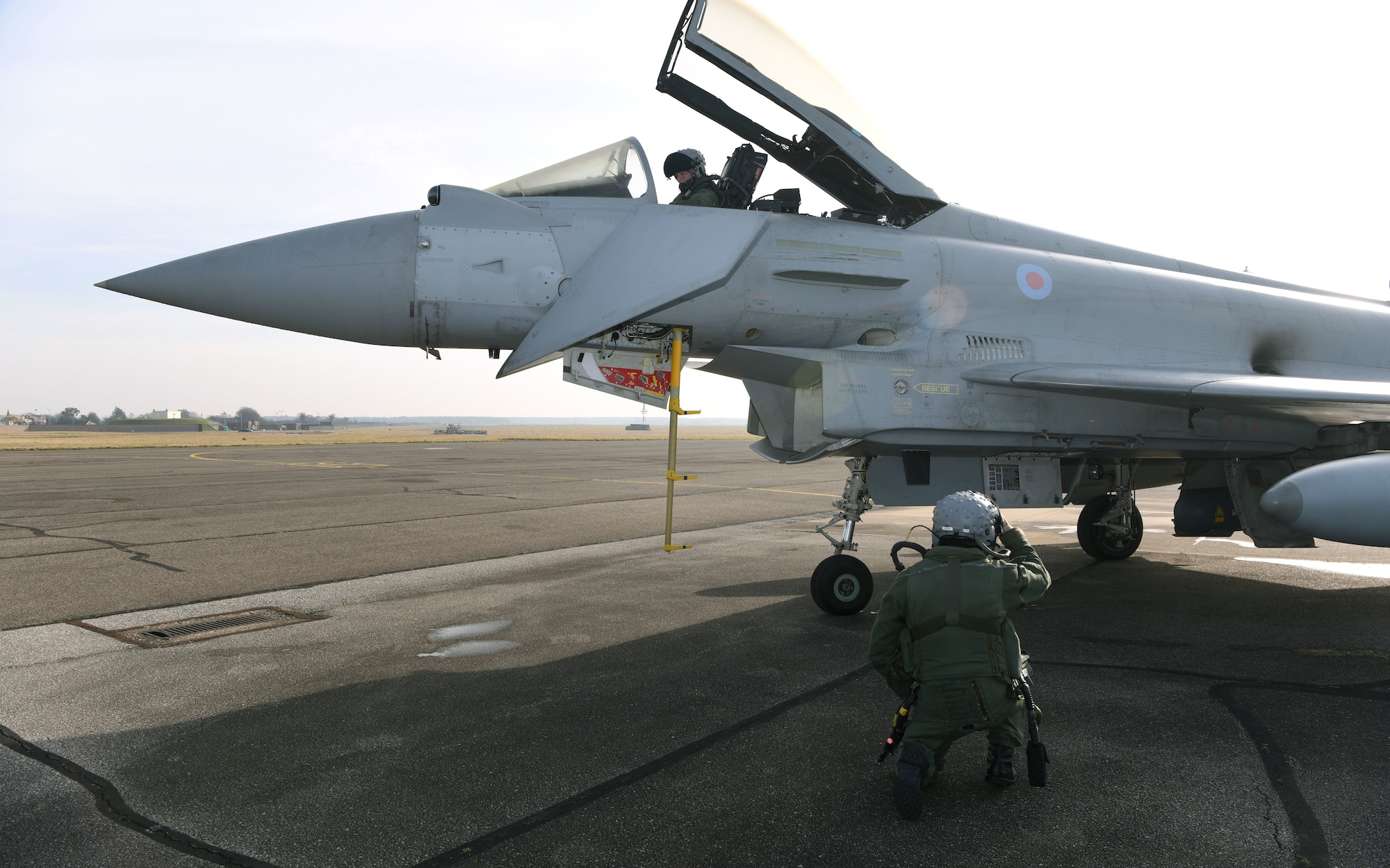 A Royal Air Force Eurofighter Typhoon FGR4 sits on the taxiway as pilots perform pre-checks prior to take-off at Royal Air Force Mildenhall, England, Feb. 15, 2023. The aircraft from RAF Coningsby, England, diverted here due to bad weather. The Typhoon is a highly capable and extremely agile multi-role combat aircraft, capable of being deployed for the full spectrum of air operations, including air policing, peace support and high-intensity conflict. (U.S. Air Force photo by Karen Abeyasekere)