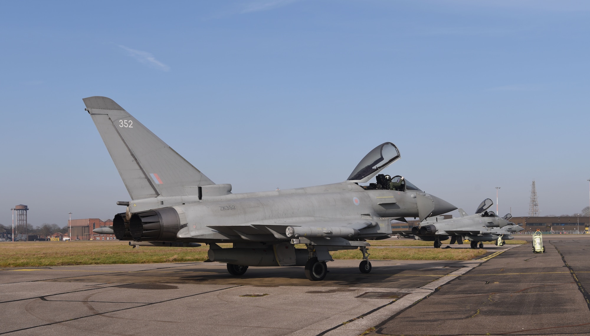 Royal Air Force Eurofighter Typhoons sit on the taxiway at Royal Air Force Mildenhall, England, Feb. 15, 2023. The aircraft, from RAF Coningsby, England, diverted here due to bad weather. The Typhoon is a highly capable and extremely agile multi-role combat aircraft, capable of being deployed for the full spectrum of air operations, including air policing, peace support and high-intensity conflict. (U.S. Air Force photo by Karen Abeyasekere)
