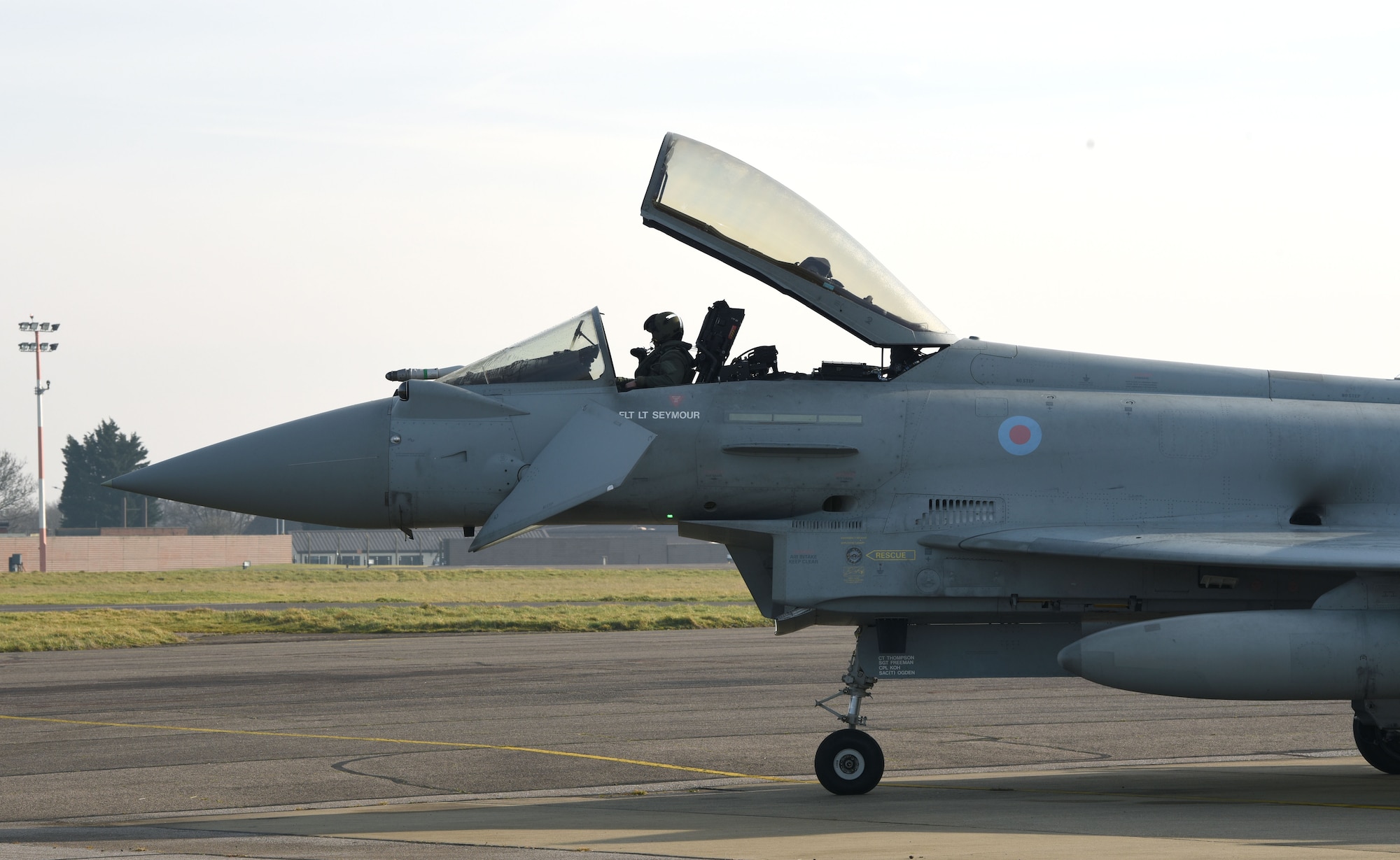 A Royal Air Force Eurofighter Typhoon FGR4 sits on the taxiway as a pilot does pre-checks prior to take-off at Royal Air Force Mildenhall, England, Feb. 15, 2023. The aircraft from RAF Coningsby, England, diverted here due to bad weather. The Typhoon is a highly capable and extremely agile multi-role combat aircraft, capable of being deployed for the full spectrum of air operations, including air policing, peace support and high-intensity conflict. (U.S. Air Force photo by Karen Abeyasekere)