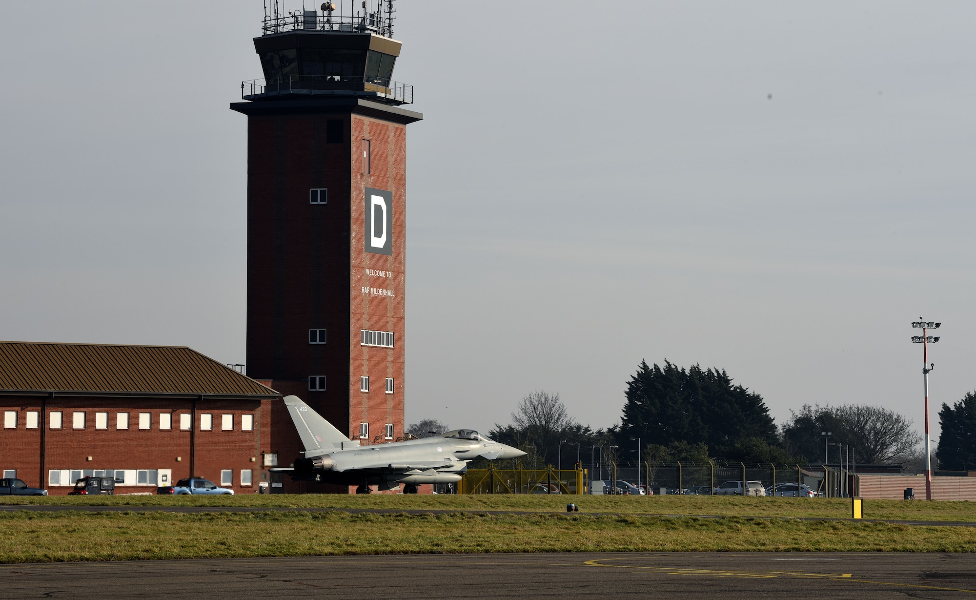 A Royal Air Force Eurofighter Typhoon FGR4 taxis past the air traffic control tower as it prepares to take off at Royal Air Force Mildenhall, England, Feb. 15, 2023. The aircraft, from RAF Coningsby, England, diverted here due to bad weather. The Typhoon is a highly capable and extremely agile multi-role combat aircraft, capable of being deployed for the full spectrum of air operations, including air policing, peace support and high-intensity conflict. (U.S. Air Force photo by Karen Abeyasekere)