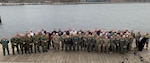 Military personnel from the United States, Denmark, Norway, Finland and Sweden pose for a photograph during a conference focused on sharing airspace information in Copenhagen, Denmark, in January 2023. The New York Air National Guard's 152nd Air Operations Group sent a delegation of three officers to the meeting.